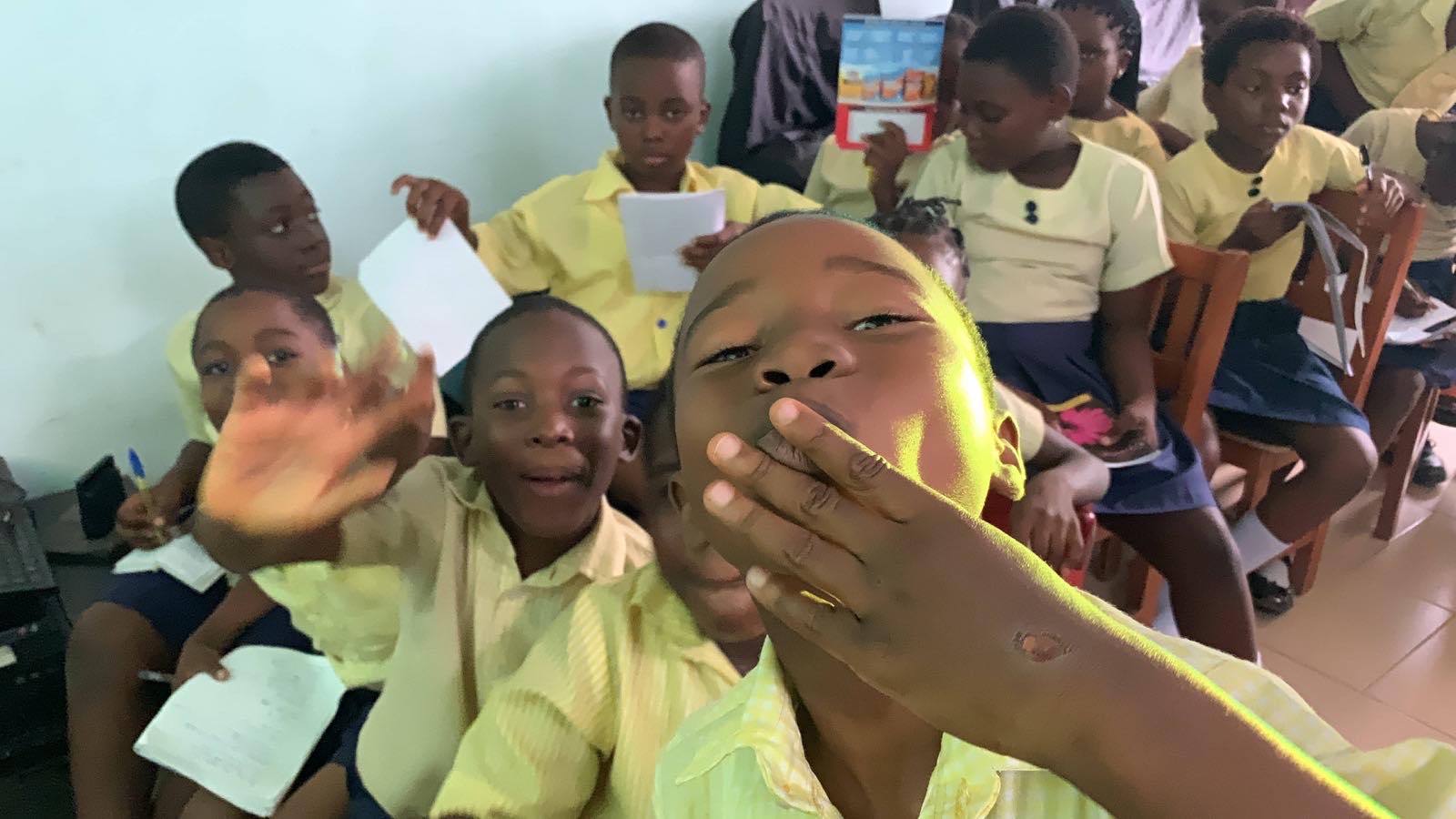 Pupils crowding in for a photo during a school visit